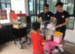 Popcorn and cotton candy rental setup at an outdoor event in Malaysia.