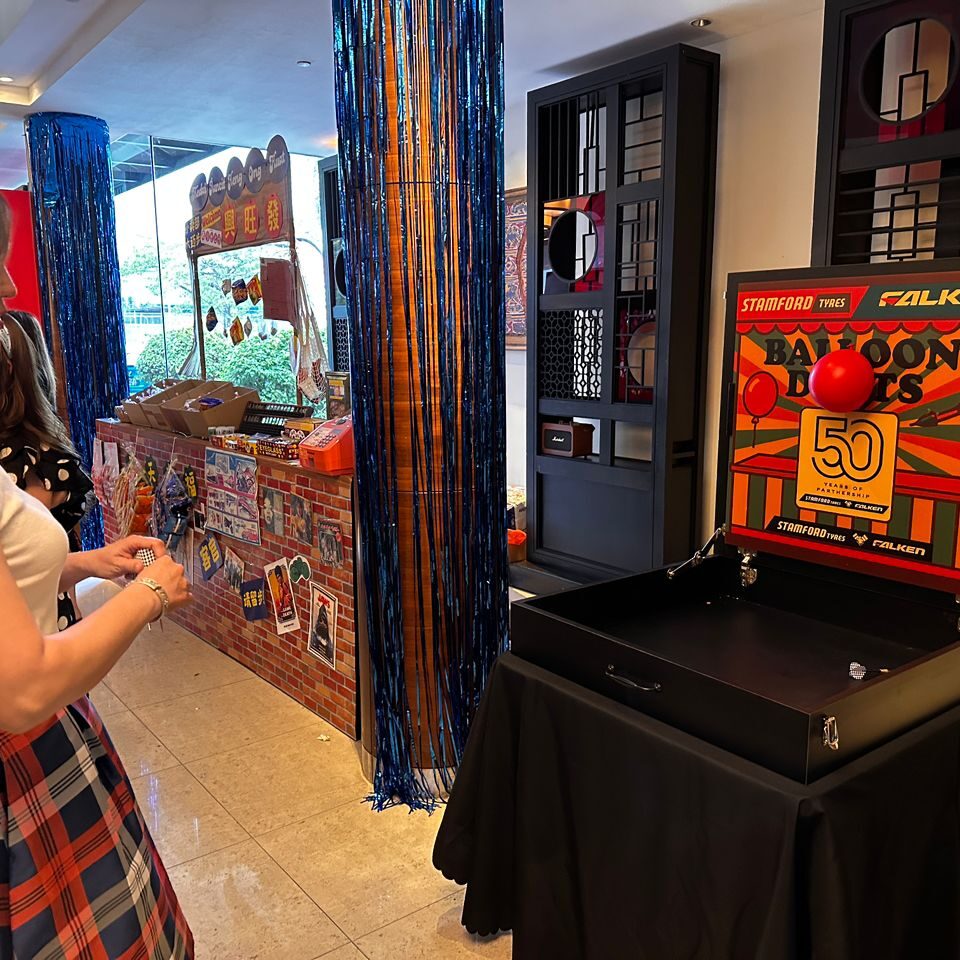 Carnival game booth rental in Malaysia for Stamford Tyres and Falken client event, creating fun engagement and interactive brand experiences.