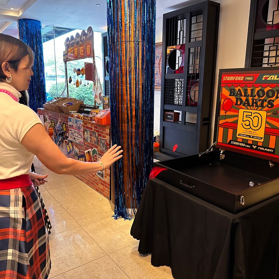 Carnival game booth rental in Malaysia for Stamford Tyres and Falken client event, creating fun engagement and interactive brand experiences.