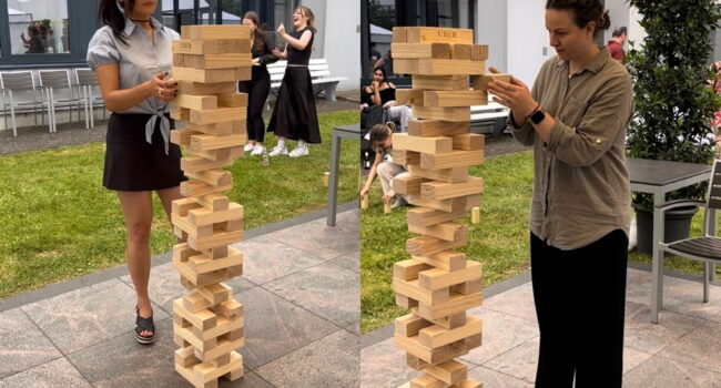 Giant Jenga rental game being played at a corporate team building event