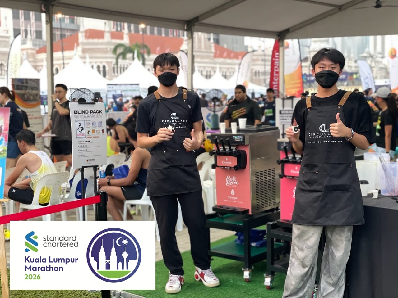 Circusland crews serving soft serve ice cream at the Counterpain booth during Standard Chartered Kuala Lumpur Marathon 2026 at Dataran Merdeka.